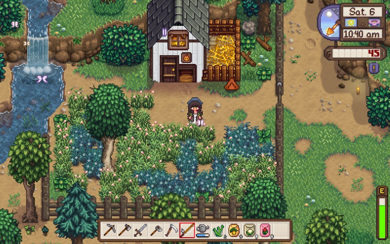A screenshot of my character standing outside the small chicken coop on my Stardew Valley farm